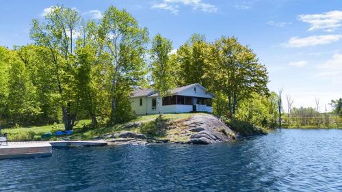 McKellar House | Golden Sunset Retreat with Canoe, Fire Pit & Views