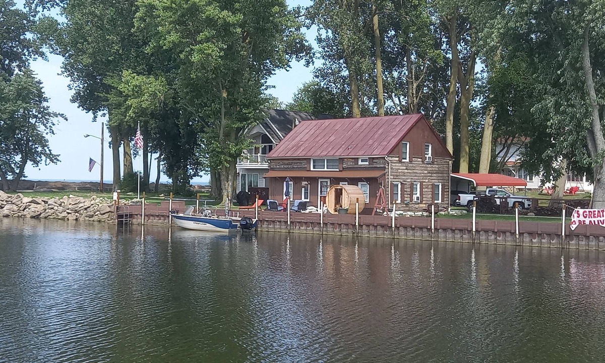 Huron Cabin | Lakefront 1928 Log Cabin w/Sauna, Docking, Fishing, Patio, Big Yard & Balcony