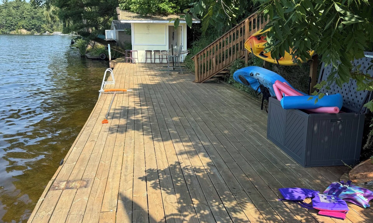 Newaygo Cottage | Lakefront Retreat near Dragon Trail! Big Dock, Patio, Views & More!