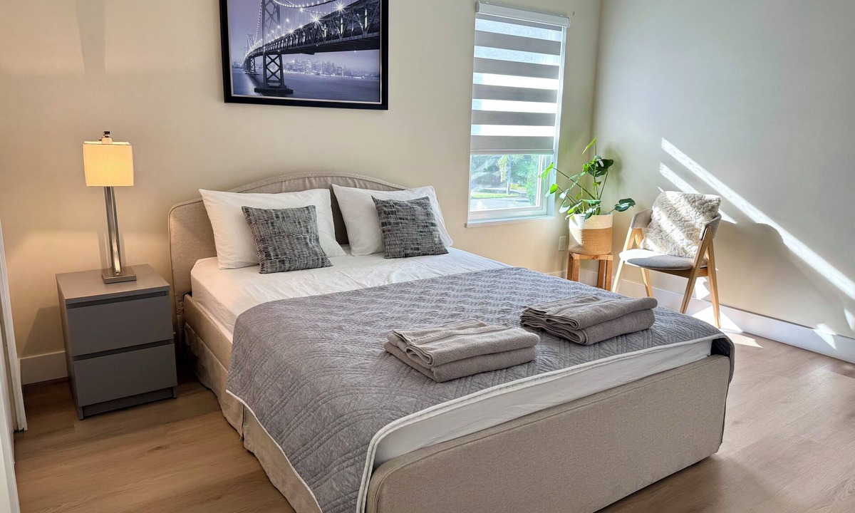 Surrey House | Master bedroom with private bathroom in British Columbia, Canada