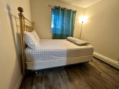Northeast Edmonton House | Private bedroom with queen bed