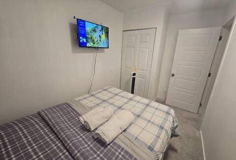 West Edmonton House | Bedroom with TV in Upland E