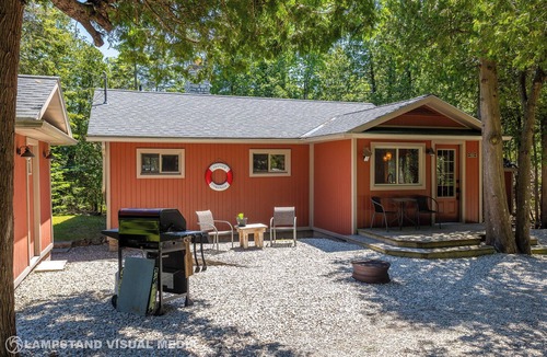 Northern Bruce Peninsula House | Breezy Woods Cottage is a private, cedar-lined escape on Georgian Bay. Enjoy rustic charm, a stone fireplace, stunning forest views, and a peaceful waterfront firepit area—just minutes from Tobermory’s top attractions.