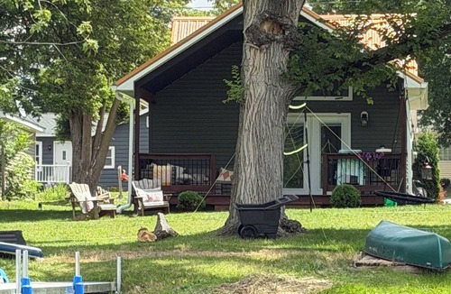 Dowling House | Bungalow on the water offers a canoe, paddle boards, paddle boat, fishing gear.