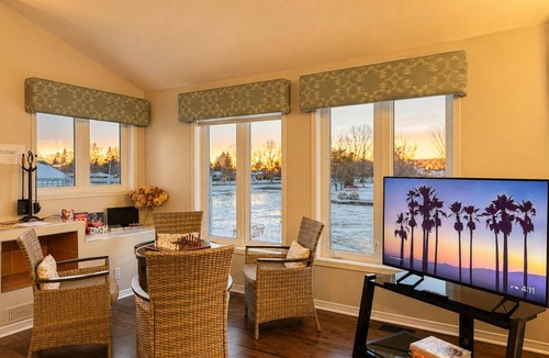 Lagoon City Cottage | Canalside summer cottage w/river views, fire table & outdoor cushioned seating
