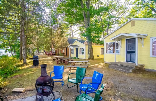 Indian River Cottage | Charming lakefront cottage with large yard, dock, & fire pit - close to downtown