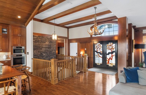Southwest Edmonton House | Fortunato means "the fortunate one." This former Full House Lottery Dream Home has a private theatre, spa bathroom with soaker tub & heated towel drawer, a wine room, double sided fireplace & a full bar. Lodge luxury in Windermere.