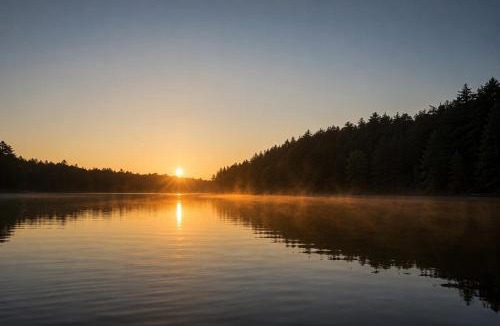 McKellar House | Golden Sunset Retreat with Canoe, Fire Pit & Views