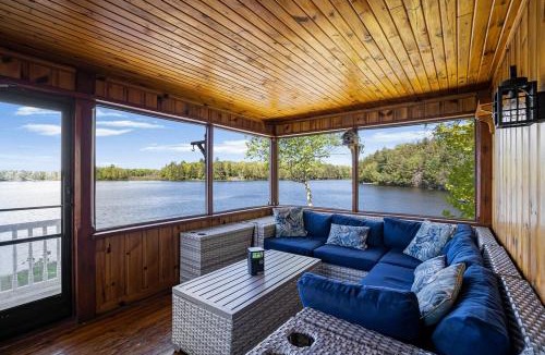 McKellar House | Golden Sunset Retreat with Canoe, Fire Pit & Views