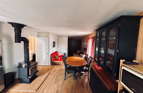 La Malbaie Cabin | Horse shelter. Located on a ranch with a view of the horses. Pets allowed.