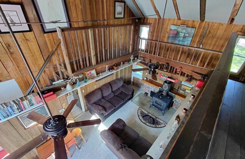 Huron Cabin | Lakefront 1928 Log Cabin w/Sauna, Docking, Fishing, Patio, Big Yard & Balcony