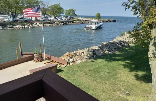 Huron Cabin | Lakefront 1928 Log Cabin w/Sauna, Docking, Fishing, Patio, Big Yard & Balcony