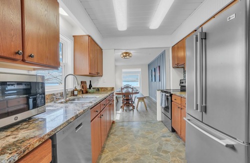 Carp Lake Cottage | Lakefront Cottage, Dock, EV Charger, Firepit, Bunkhouse, Family & Pet Friendly