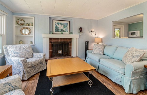 Frankfort Cottage | Lakefront historic cottage with firepit, basketball court access, & kayaks