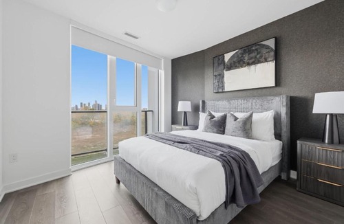 The Queensway Apartment | Modern 3BR Condo Sleeps 8 with Floor-to-Ceiling Views