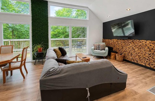 Amherst House | Modern Retreat in Forest with Hot Tub