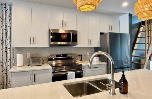 Harvie Heights Condo | Mountain Views Family-Friendly BBQ Shared Hot Tub