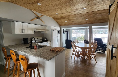 Adstock Ski Chalet | Ohana Chalet, on the Water's Edge with a Private Dock