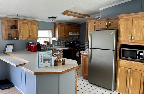 Upper Peninsula Michigan House | Relaxing getaway with fenced in yard & hot tub!