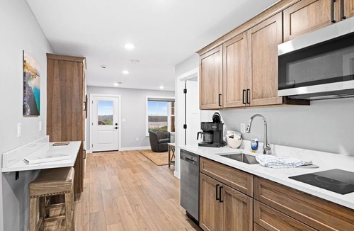 Riverside Apartment | RiverWest Trails End Chalet -Hot Tub - River View - Dog Friendly