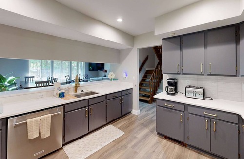 Maple City House | Secluded home with three kitchens, vaulted ceilings, washer/dryer, & patios