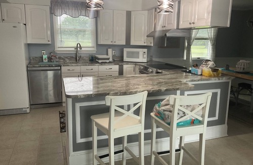 White Marsh Villa | Secluded Waterfront Retreat 2 bed 1 1/2 baths private guest house w Pool & Beach
