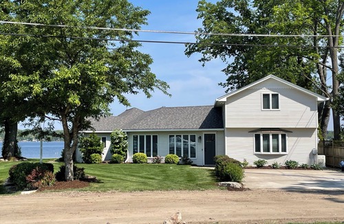 Brighton House | Spacious 4BR Lakefront Home with dock, deck, wifi, AC, & large yard in Brighton