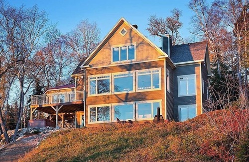 Baie-St-Paul Ski Chalet | Stunning windows overlooking the riverbank