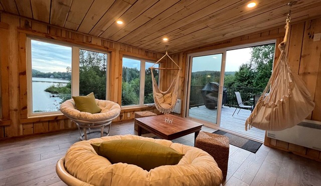 At the edge of a navigable lake offering dazzling sunsets.