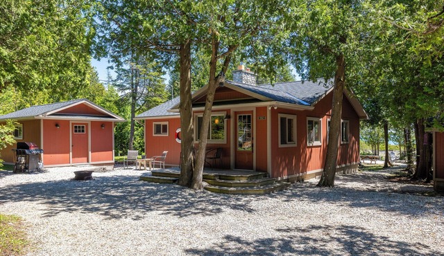 Breezy Woods Cottage is a private, cedar-lined escape on Georgian Bay. Enjoy rustic charm, a stone fireplace, stunning forest views, and a peaceful waterfront firepit area—just minutes from Tobermory’s top attractions.