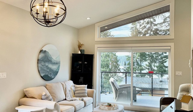 Contemporary lake cottage steps from private beach, dock & trails