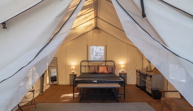 Experience the perfect blend of camping at the Rocky Top Retreat Glamping Tent.