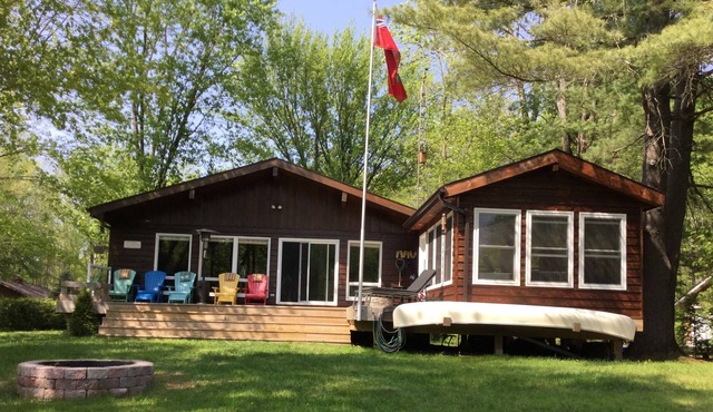 Family sized cottage with dock,deck,gazebo,firepit,small sandy beach.