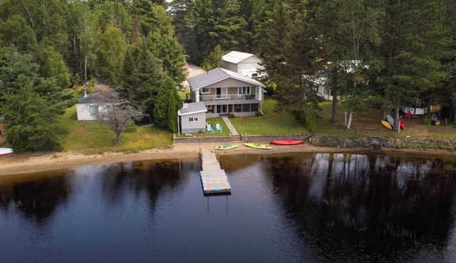 Four Season Serene Lake House with Stunning Lake Views, Private Dock and Sauna.