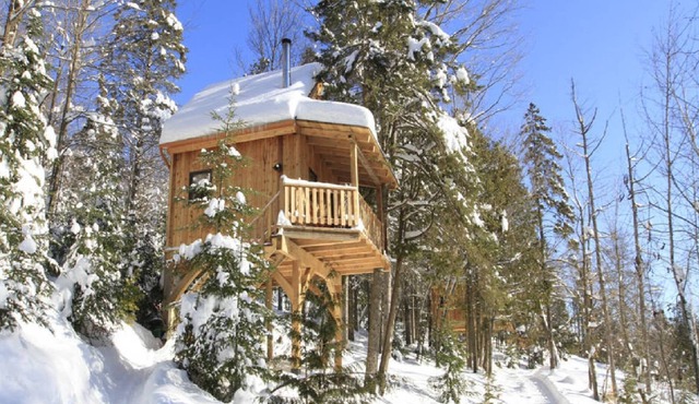 In the heart of the Laurentians in the middle of nature with its lakes