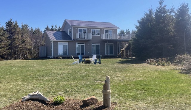 Large beach house with cottage feel, with ocean views and steps from sandy beach