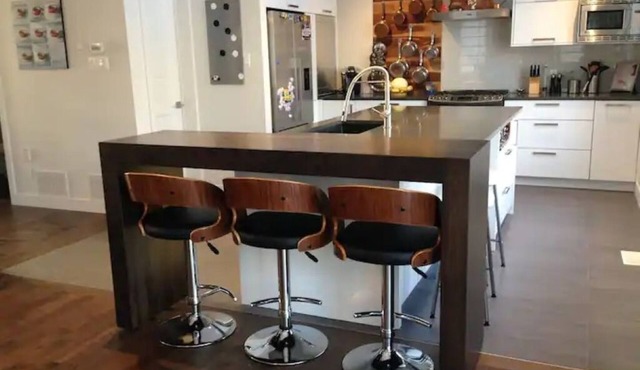 Large modern house with open concept, a/c, heated swimming pool, large garden.