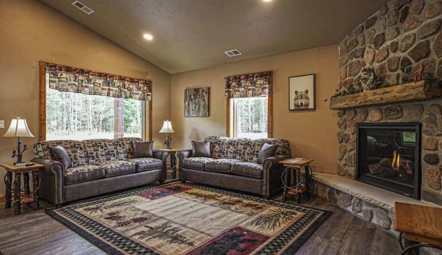 Modern dog-friendly cabin with hot tub, gas fireplace, patio, grill, & washer/dr