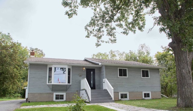 Renovated open concept family sized Home with game room and fire pit in backyard