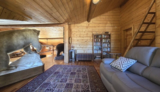 Room 2 at the Main Lodge with a queen bed and single bed.