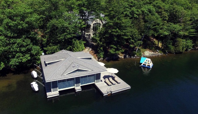 Stunning Cottage on Lake Joe! 6 bdrm,6 bath,2 slip boathouse! Water Toys Galore!