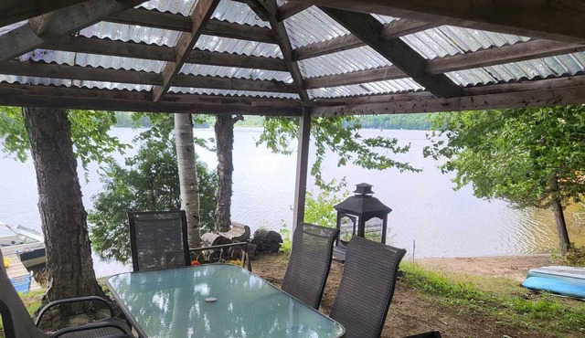 Tranquil cottage on a lake with canoes, dock and lots of peace.