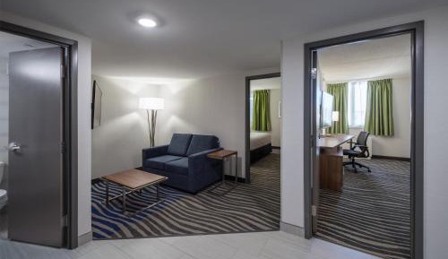 Two-Bedroom Suite with One King and Two Queen Beds, Living Room, Sofa and Walk-In Shower - Non-Smoking