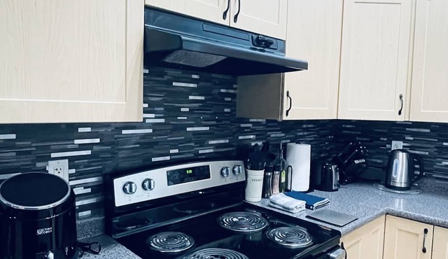 Modern Upper Level Duplex House Beside Convenience Store and Gasoline Station